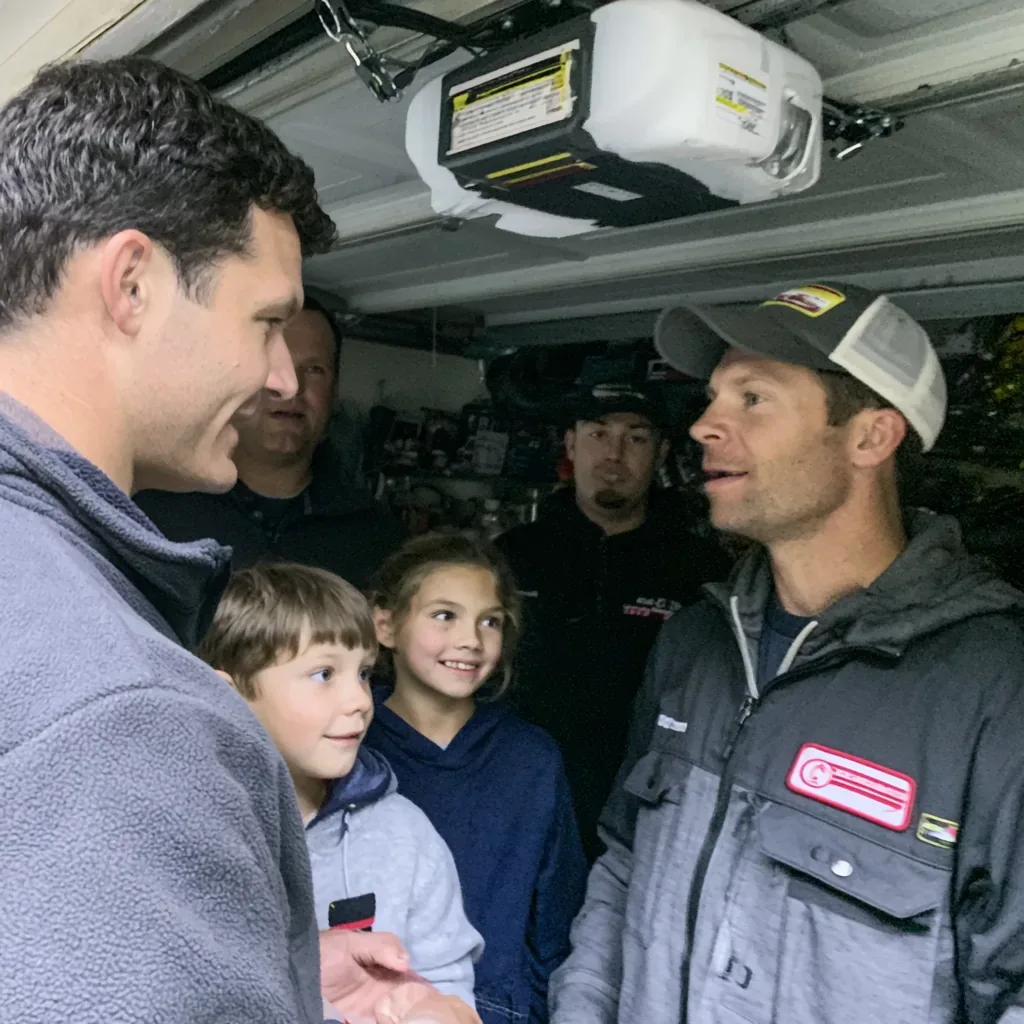 Carlsbad garage door technician talking a homeowner through the repair